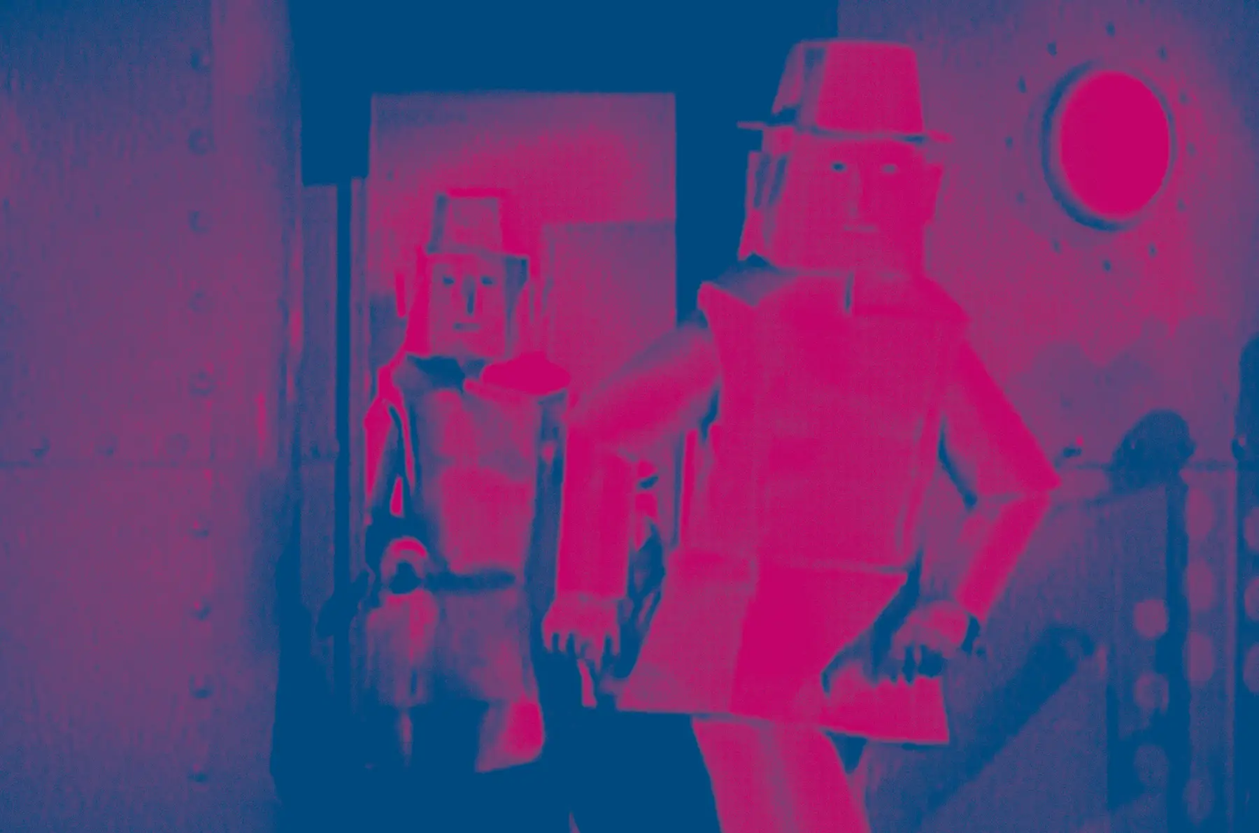 A magenta and blue concert poster image featuring toy-like figures.